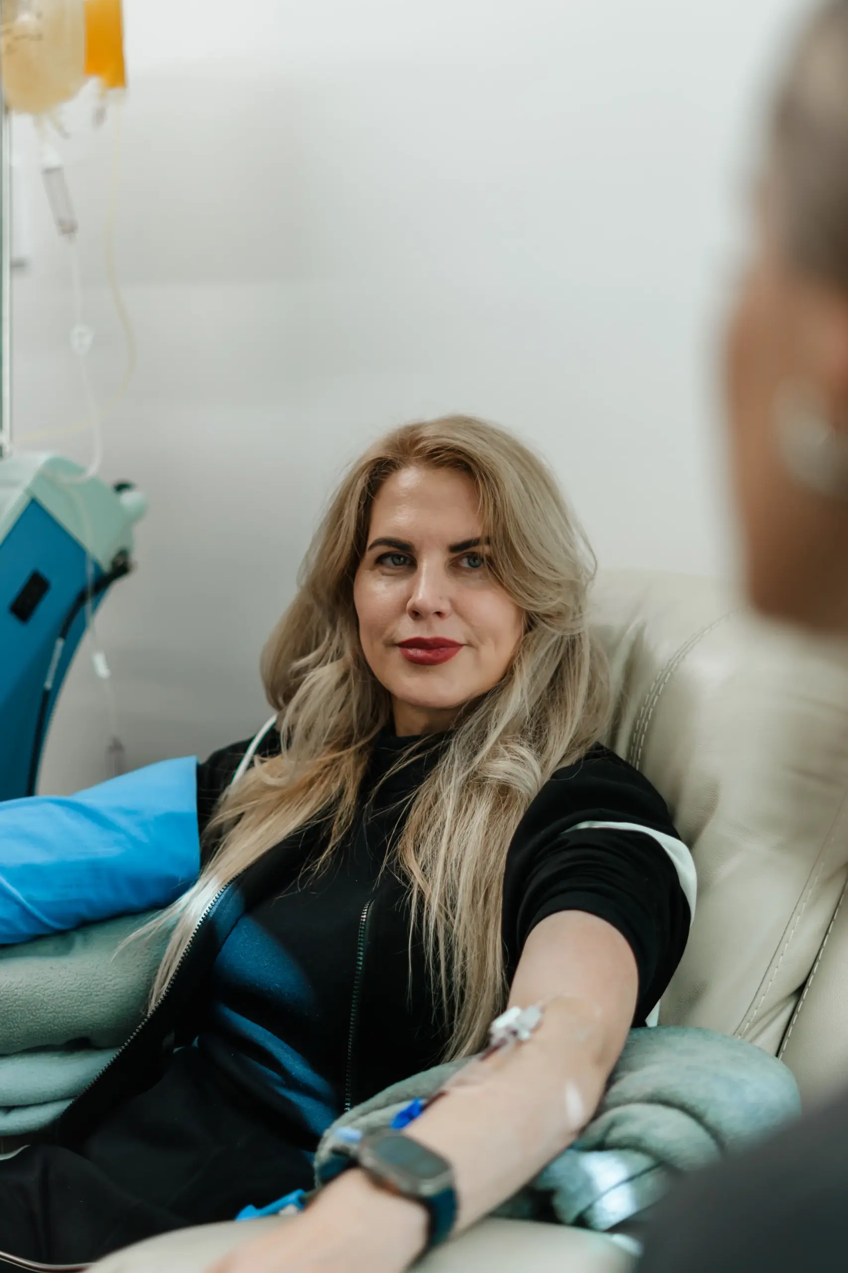 A woman receiving an intravenous regenerative treatment at RMI's clinic